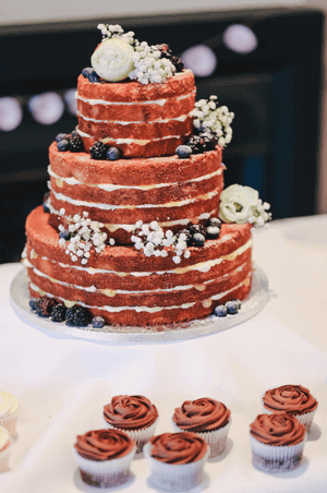 a specialty cake and cupcakes