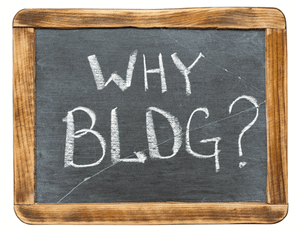 hand-held chalkboard with "Why Blog?" on it